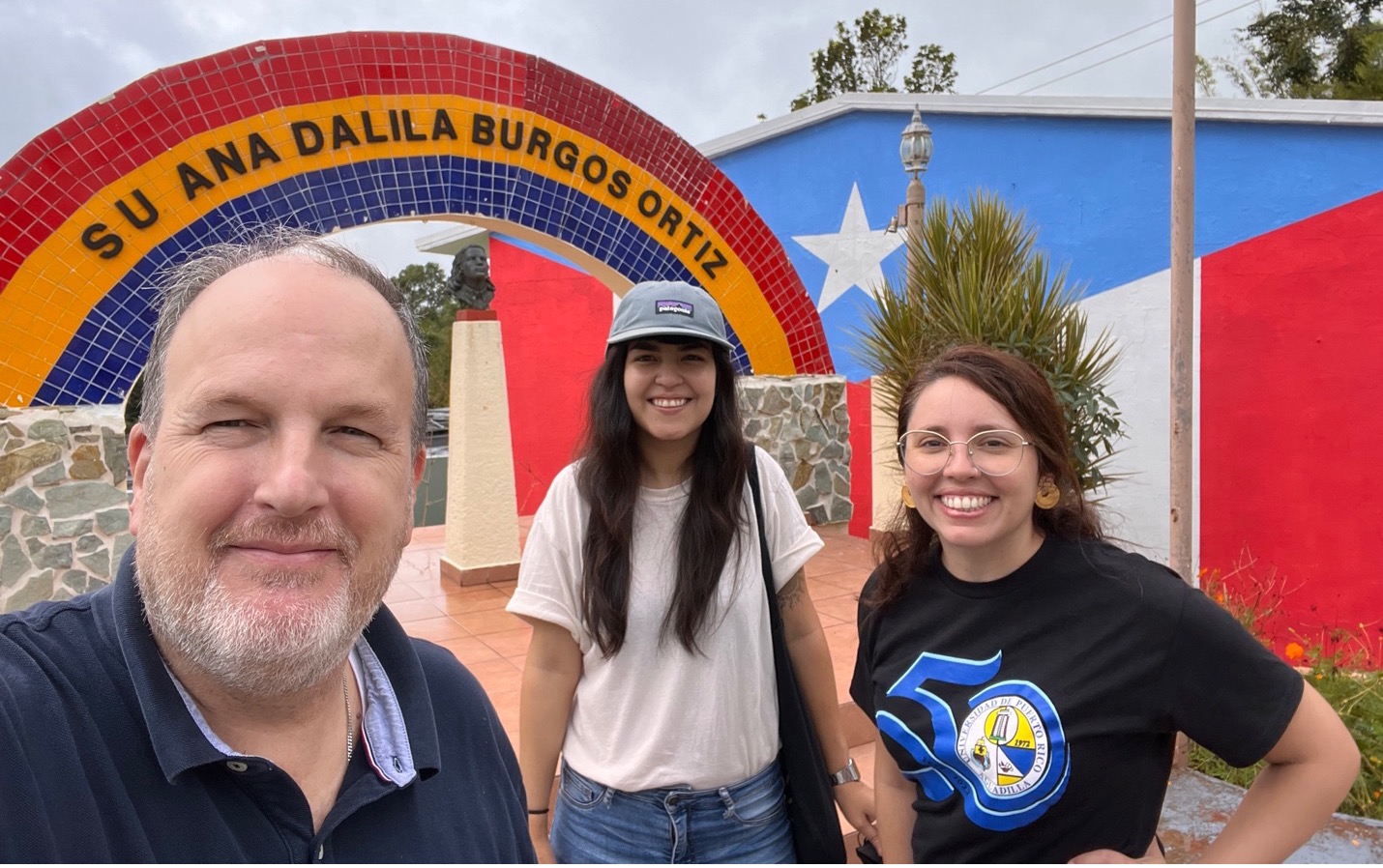 Members of the DiSCo team (pictured: Timothy Dye, PhD, Nancy R. Cardona Cordero, DrPH, and Leidymee Medina De Jesús, MS) outside of a neighborhood group in Puerto Rico.